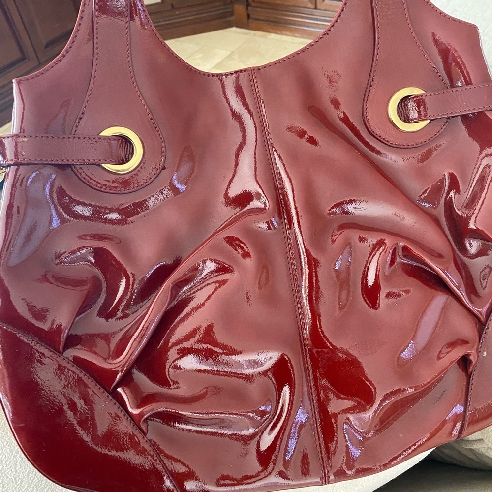 Francesco Biasia burgundy patten purse